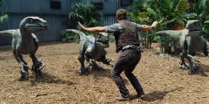 Owen (CHRIS PRATT) attempts to keep the raptors at bay in “Jurassic World”.  Notice the number of toes...